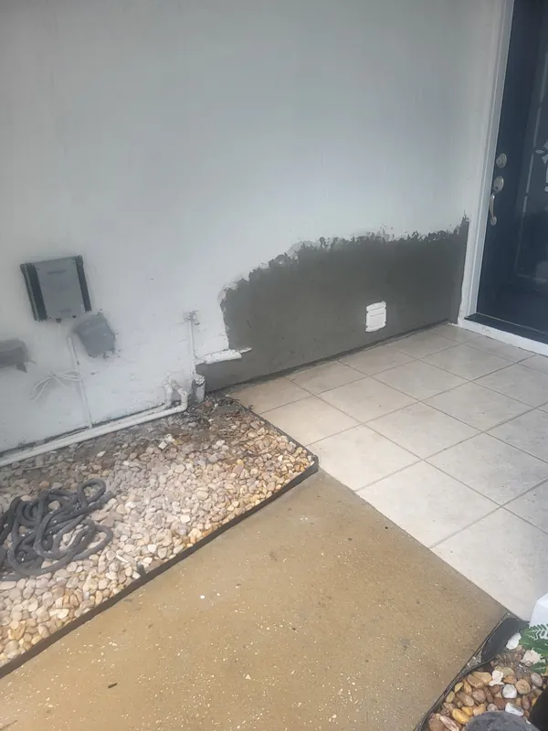 Stucco patch applied and curing